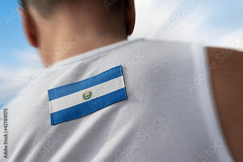 The national flag of Salvador on the athlete's back photo