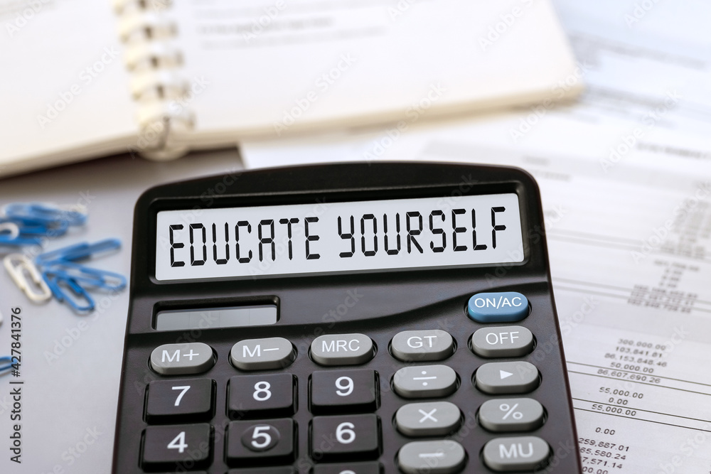 Calculator with the words EDUCATE YOURSELF on the display Calculator with the words EDUCATE YOURSELF on the display