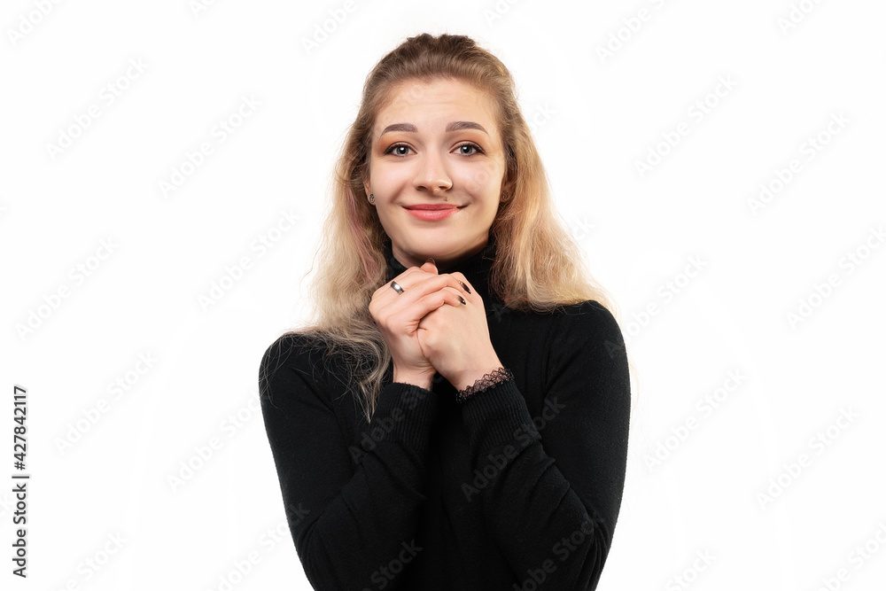 Close up dreamy blonde girl making wish, daydreaming about having something, clench fists close to chest, asking help Close up dreamy blonde girl making wish, daydreaming about having something, clench fists close to chest, asking help