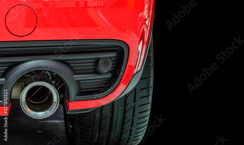 Fotografi Close-up metal intake on back red modern car on black color background and copy