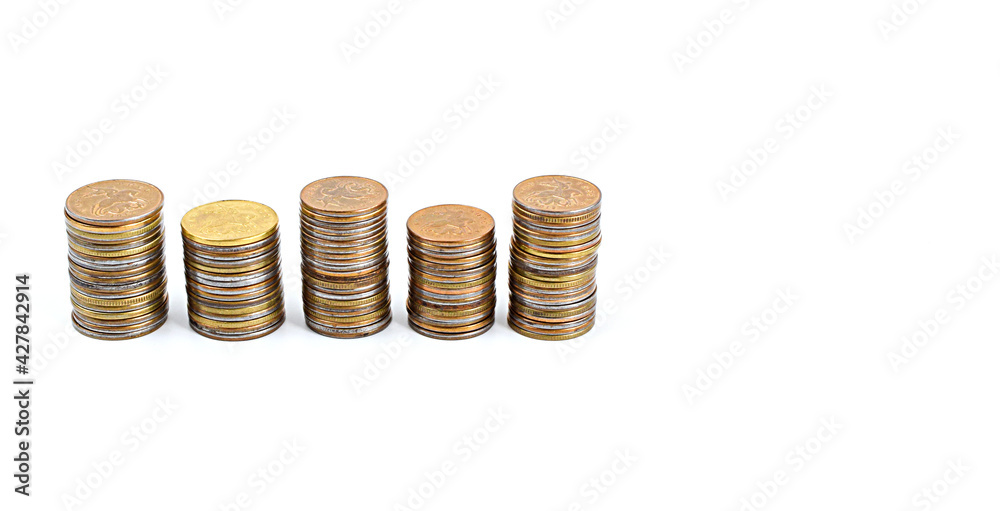 Row of metal coins isolated on white background. Investments, deposits, profits. Copy space. Row of metal coins isolated on white background. Investments, deposits, profits. Copy space.