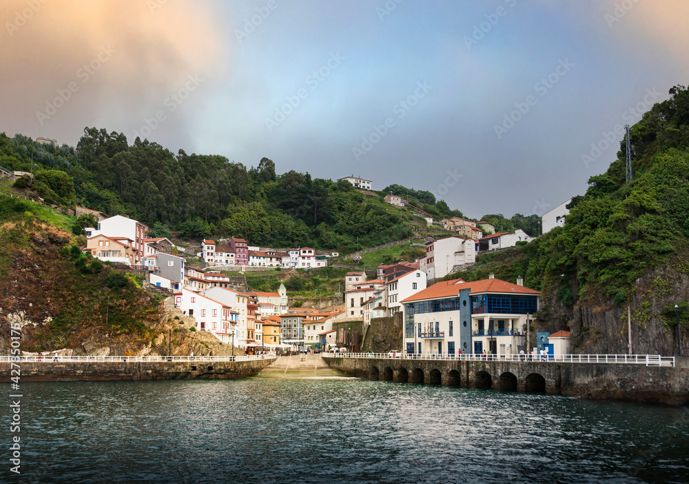 Sunset view from the sea of ​​the Asturian town of Cudillero, on the Cantabrian coast.