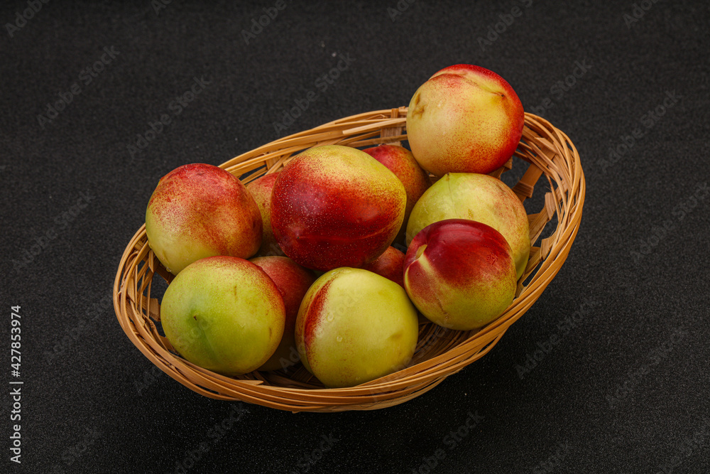 Sweet small nectarines in the basket Sweet small nectarines in the basket