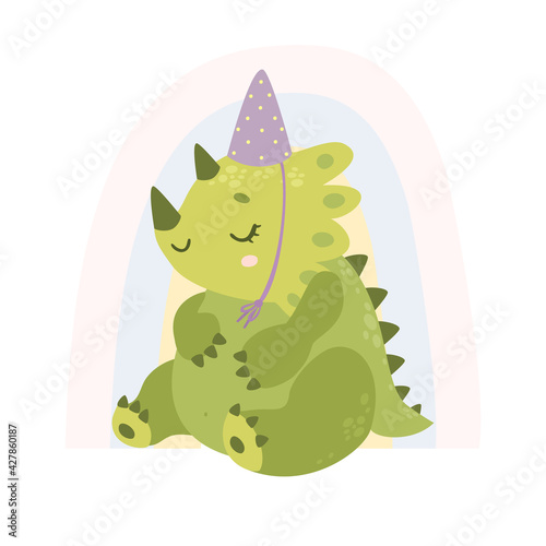 Cute dinosaur. Adorable newborn dino. Birthday party. Dinosaur on background of the rainbow in a celebratory cap