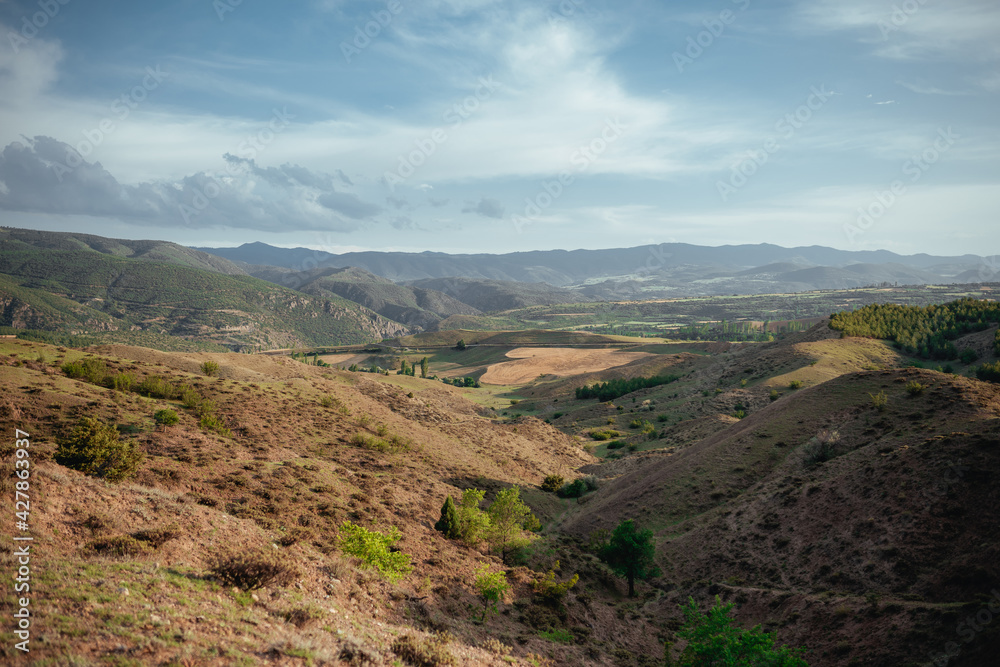 A large plain, mountains and spike fields in Anatolia A large plain, mountains and spike fields in Anatolia