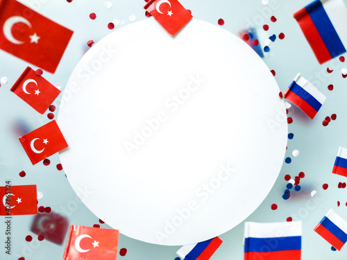 Turkey vs. Russia. Air travel ban, flight cancellations, covid pandemic. Mini flags on a foggy background.