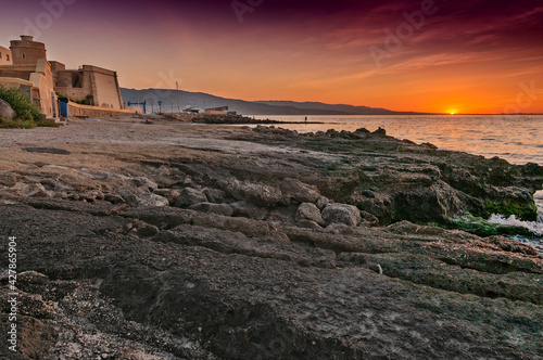 Amanecer junto al castillo de Santa Ana en Roquetas de mar photo