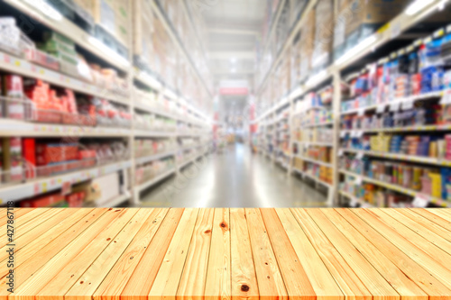 Wooden table background in the mall for placing products.