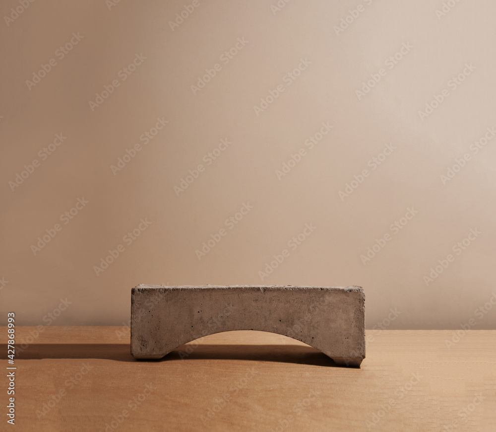 Minimal modern natural stone product display on pastel beige background. Minimal modern natural stone product display on pastel beige background.