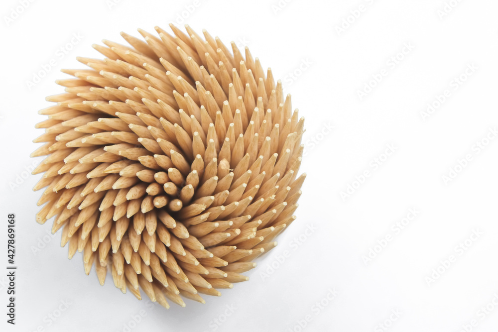 Wooden bamboo toothpicks for cleaning between teeth after eating. Wooden bamboo toothpicks for cleaning between teeth after eating.