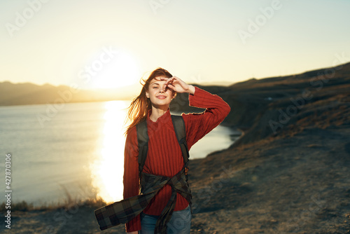 pretty woman with backpack travel rocky mountains nature fresh air