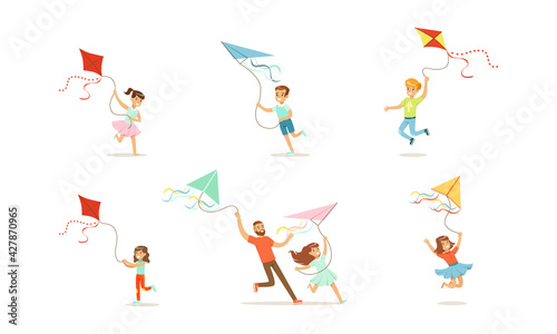 Boys and Girls Having Fun with Kites Outdoors Set, Parents and Kids Spending Good Time Together in Park Cartoon Vector Illustration