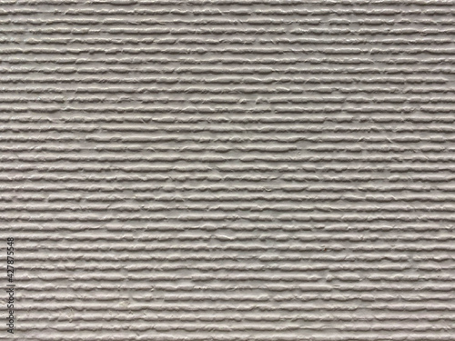 Texture of a ribbed wall with abrasions