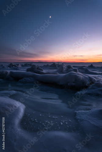 Sunset among the ice hummocks in the Kandalaksha Bay of the White Sea