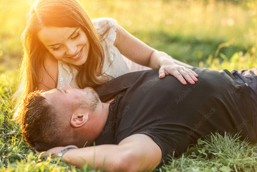 Couple lovers hugging and kissing in the park at sunset. Love, youth, happiness concept.
Couple lovers hugging and kissing in the park at sunset. Love, youth, happiness concept.