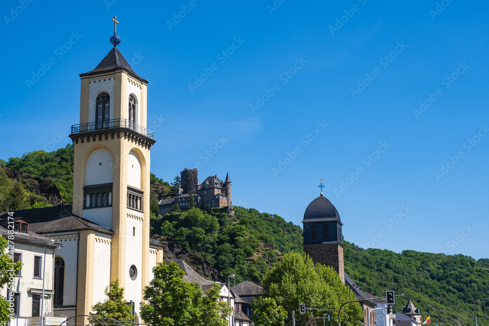 View towards the Protestant church in St. Goarshausen / Germany on the Rhine with Katz Castle in the background 