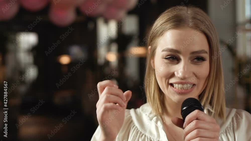 Business girl in a restaurant is discussing a business plan. Business women at a conference. Cutting-edge speaker at a business conference Business girl in a restaurant is discussing a business plan. Business women at a conference. Cutting-edge speaker at a business conference