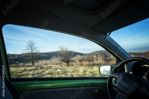 Traveling by car concept image, spring summer nature view from the car window © olezzo