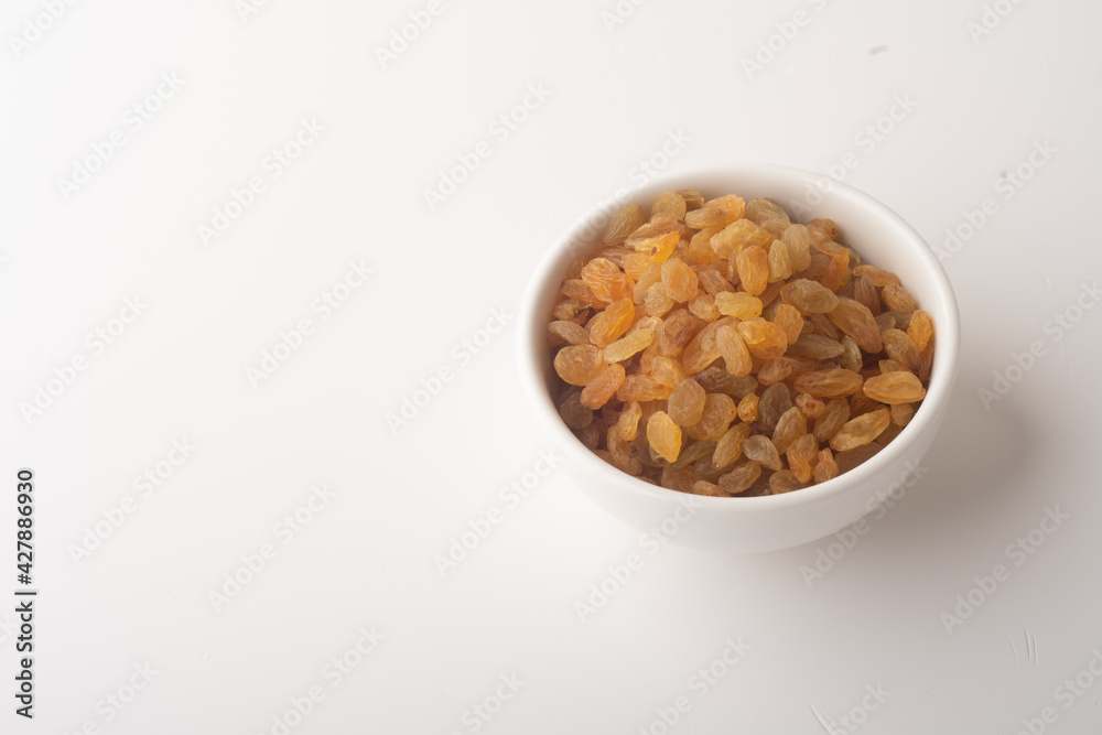 Raisins on white background, Isolated Raisin, Heap of yellow Raisins. Raisins on white background, Isolated Raisin, Heap of yellow Raisins.