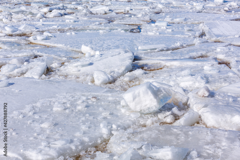 Spring day, cracked ice on the river, approaching ice drift. Spring day, cracked ice on the river, approaching ice drift.