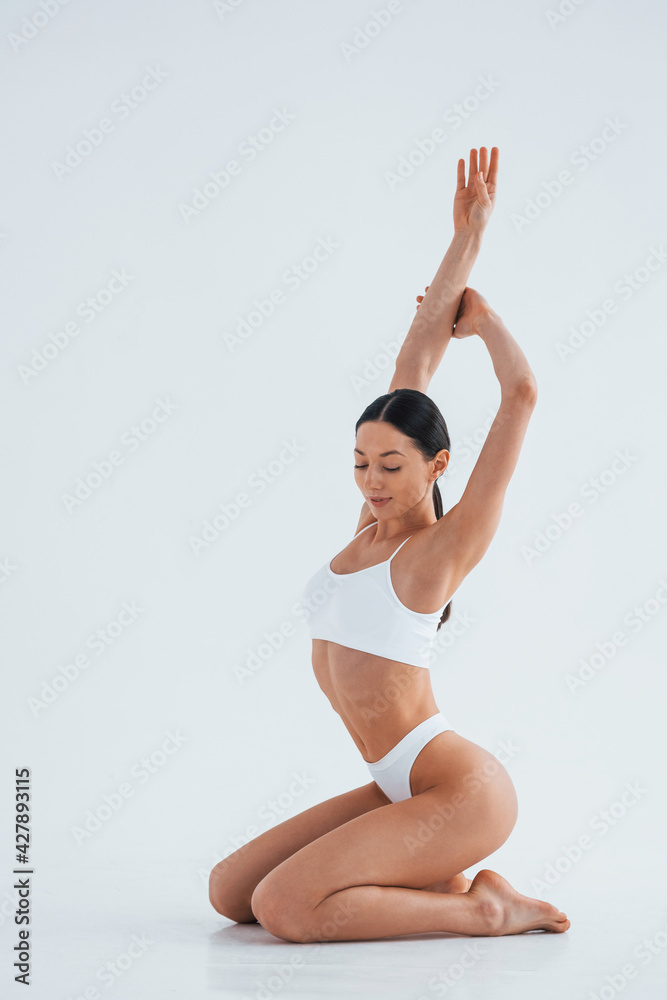 Premium Photo  Particle view woman with sportive slim body type in  underwear that is in the studio