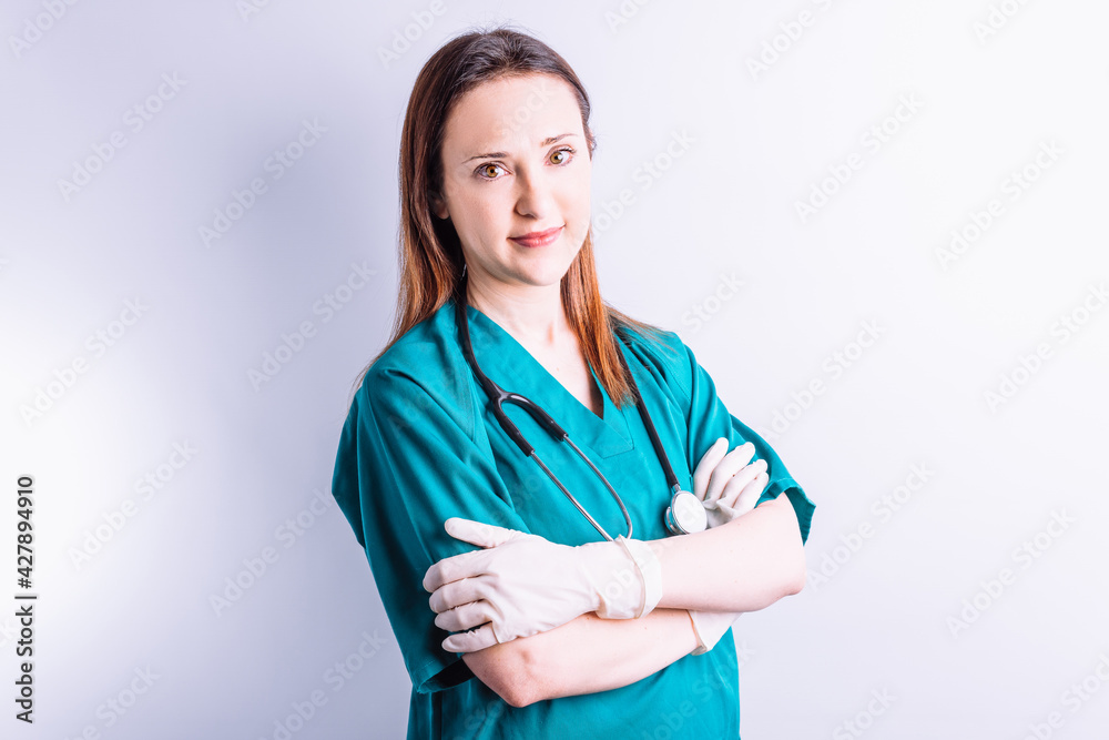Portrait of hospital doctor with stethoscope gloves looking straight ahead.medicine concept Portrait of hospital doctor with stethoscope gloves looking straight ahead.medicine concept