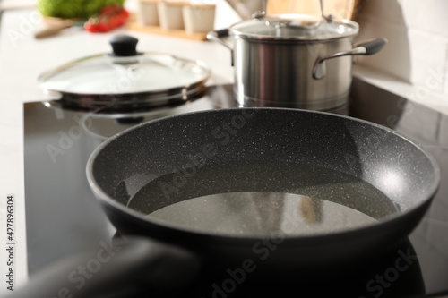 Frying pan with cooking oil on cooktop