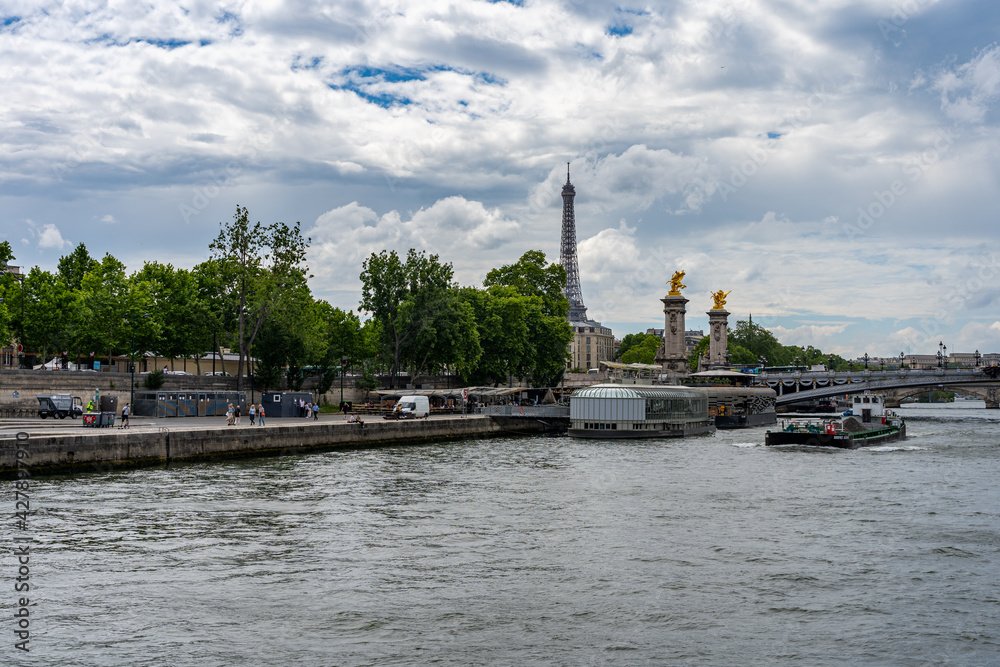 The Seine river and Eiffel Tower under summer blue sky