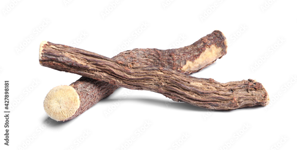 Dried sticks of liquorice root on white background