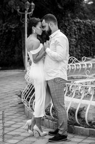 Stylish couple gently hugging. Happy sensual wedding couple embracing. Romantic moments of newlyweds.