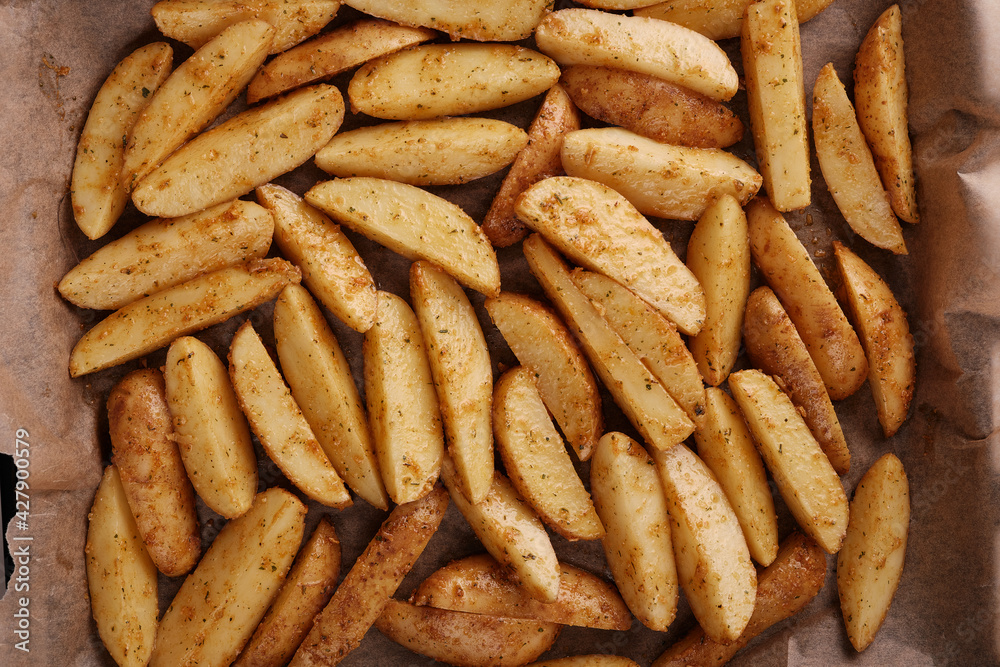 Roasted potatoes in the oven with spices and herbs. Roasted potatoes in the oven with spices and herbs.