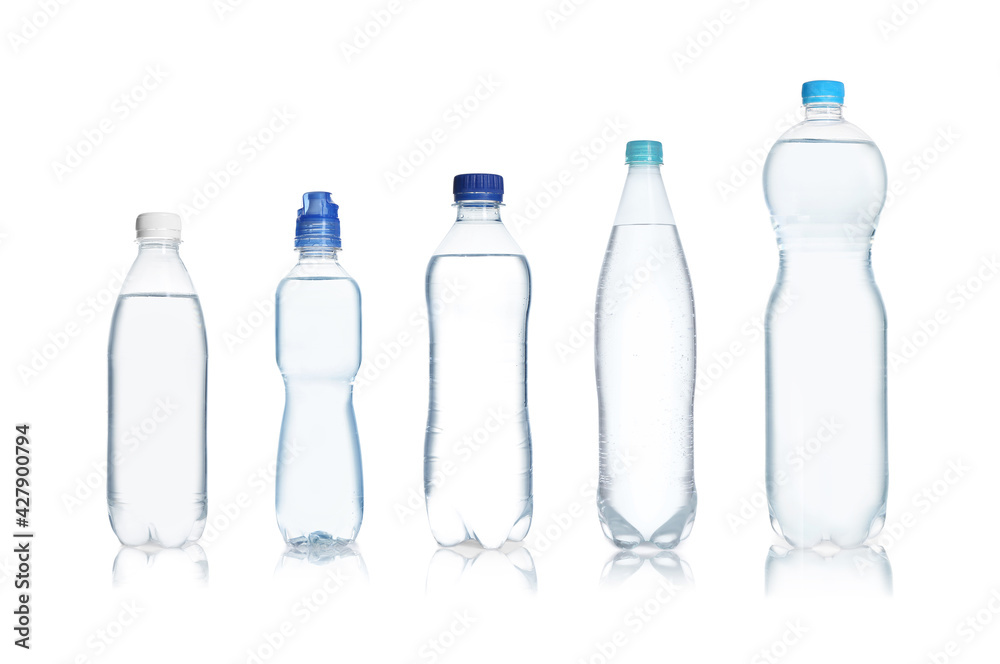 Set with different bottles of pure water on white background Set with different bottles of pure water on white background