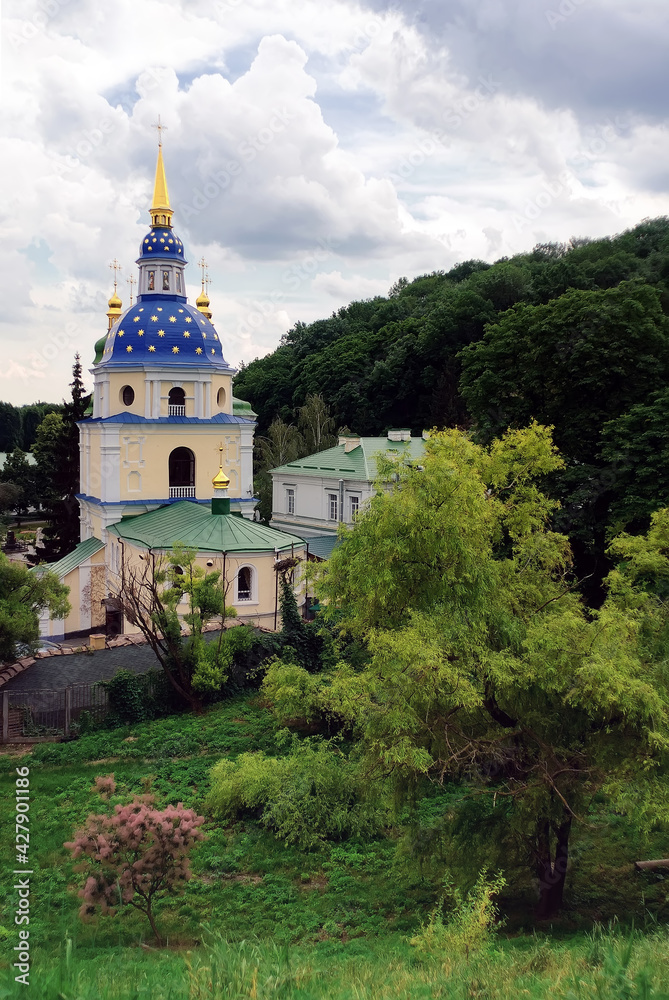 Landscape with bell tower of Vydubychi Monastery in Kyiv Ukraine