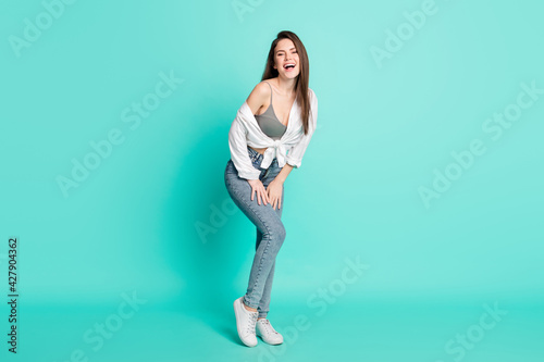 Full length photo of positive young happy nice lady good mood smile enjoy isolated on pastel teal color background