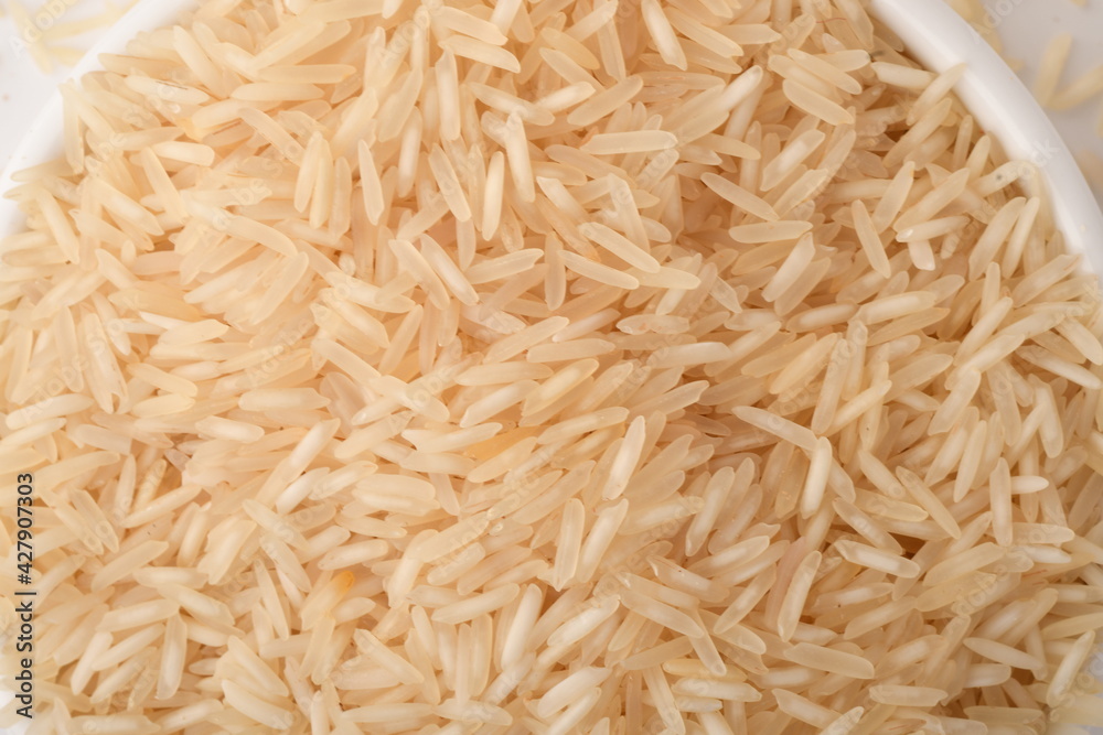 Pile of brown rice isolated on white background. Pile of brown rice isolated on white background.