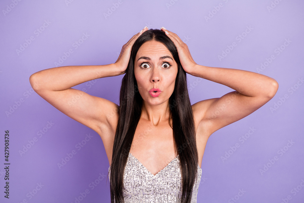 Photo of young shocked amazed surprised girl holds hands head heart bad news information isolated on violet color background