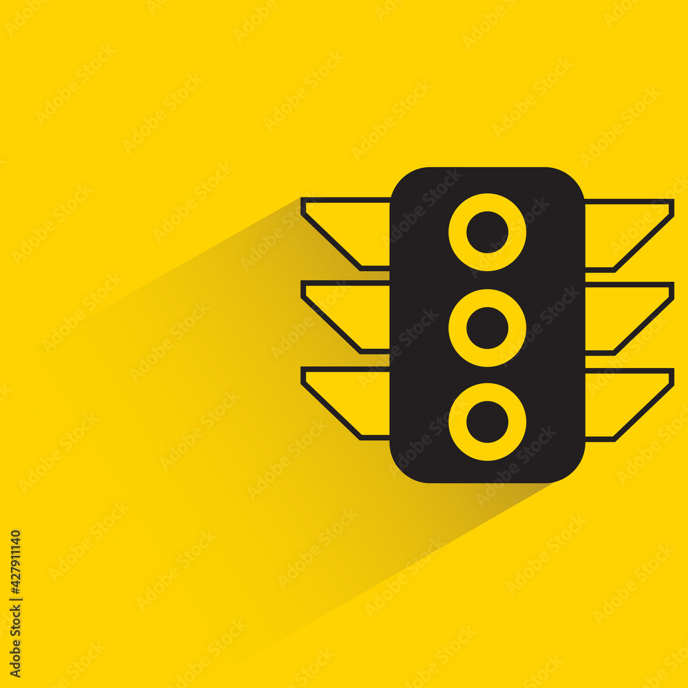 traffic light with shadow on yellow background traffic light with shadow on yellow background