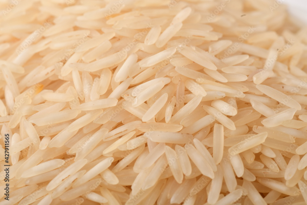 uncooked long brown rice isolated on white uncooked long brown rice isolated on white