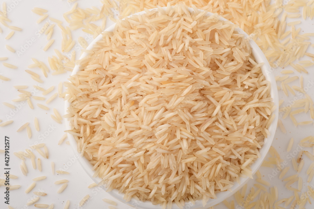 uncooked long brown rice isolated on white uncooked long brown rice isolated on white