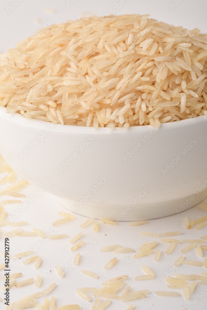 uncooked long brown rice isolated on white uncooked long brown rice isolated on white