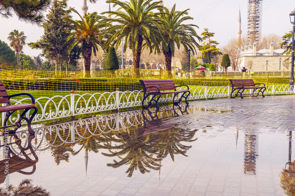 The central square of Istanbul with benches in early spring after rain.
