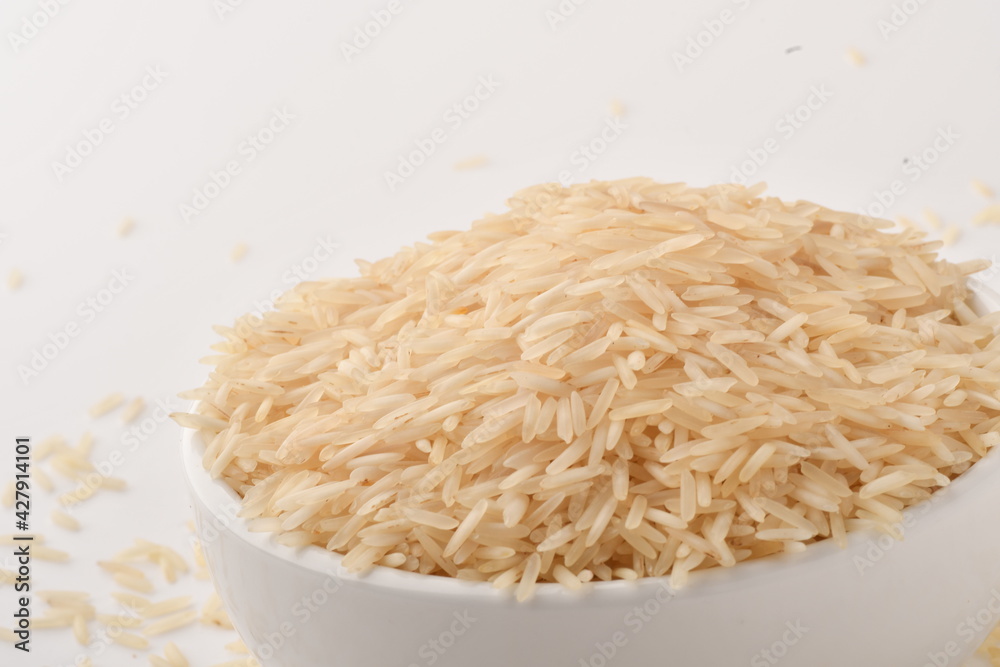 uncooked long brown rice isolated on white uncooked long brown rice isolated on white