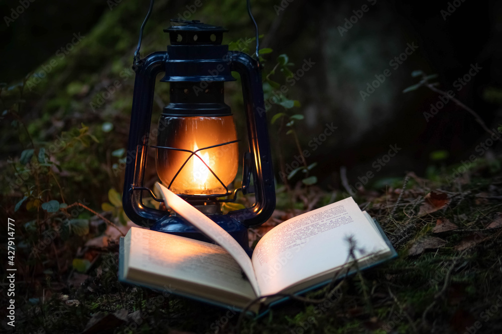 A magic kerosene lamp  and the book in the dark forest