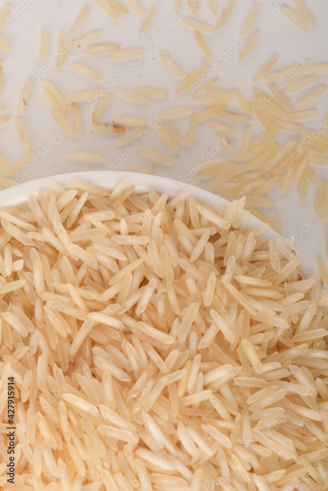 uncooked long brown rice isolated on white uncooked long brown rice isolated on white