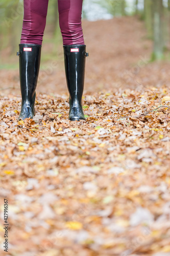 black women's boots in the autumn landscape