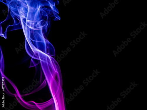 Colored smoke on black background