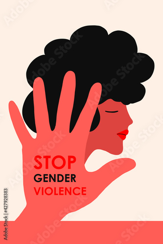 Stop domestic violence. A girl with black hair on the background of a hand with an inscription against violence. The concept is intended for a crisis care center or for the protection of women s