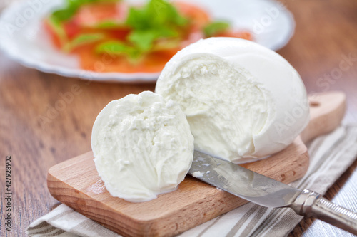 Buffalo Mozzarella, Italian cheese on wooden board.