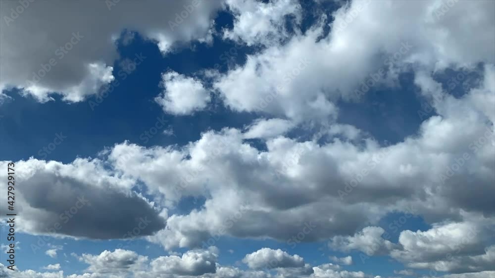 Light white clouds fly across the blue sky. Cloud movement. Background of a spring cloud landscape. Copy space Light white clouds fly across the blue sky. Cloud movement. Background of a spring cloud landscape. Copy space