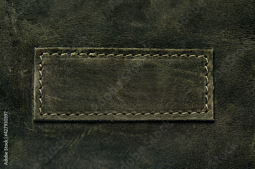 Elegant dark olive leatherette background. Leather texture. Free space for text. photo